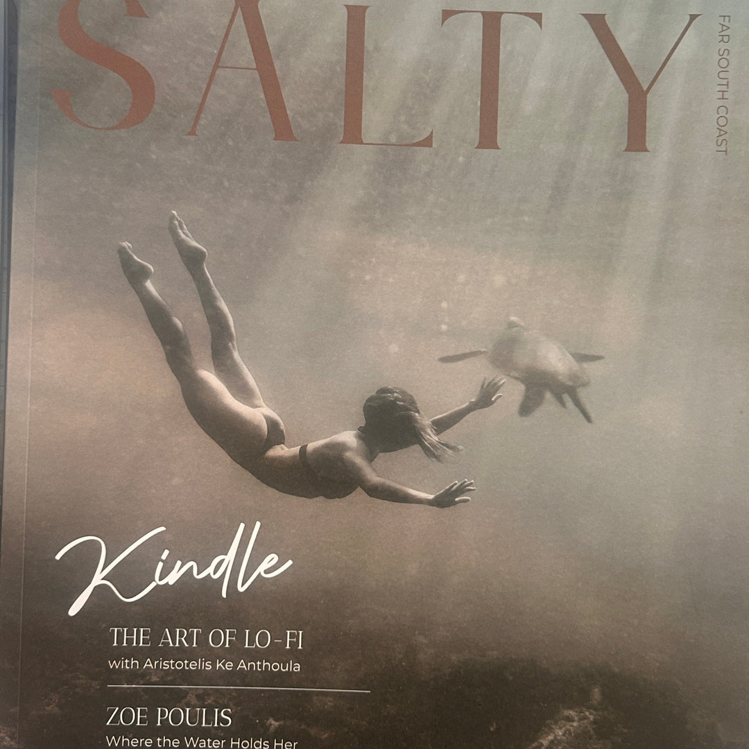 Magazine cover titled 'Salty' with a person diving into water and a turtle, featuring text about content and editions.