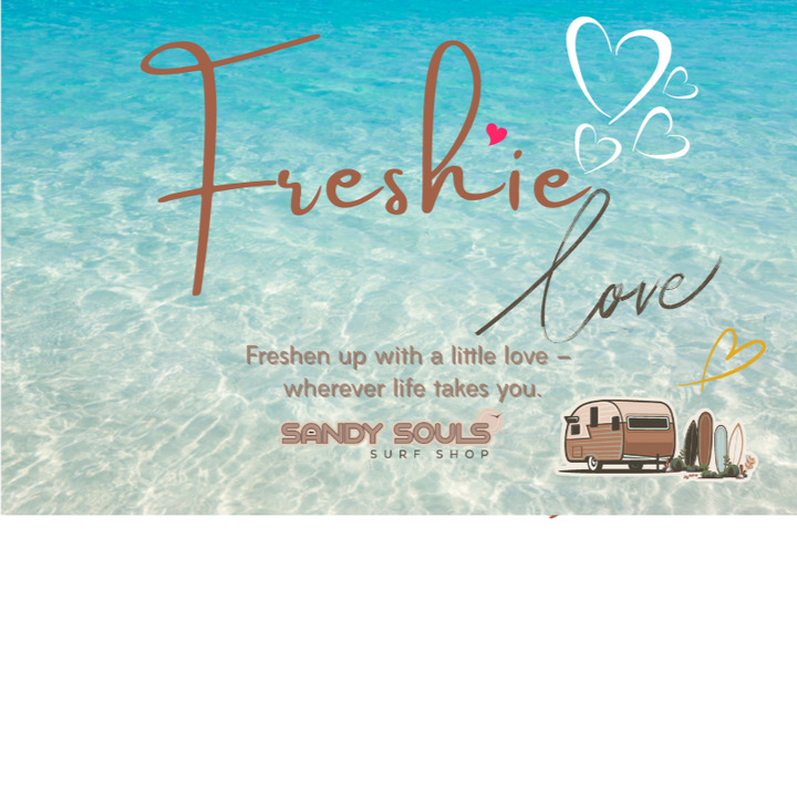 Product packaging with 'Freshie Love' text and a heart symbol on a beach background.