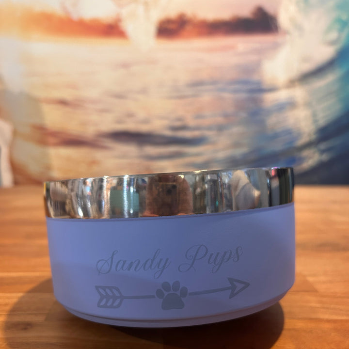 Purple pet water bottle with 'Furbly Pups' branding on a wooden surface