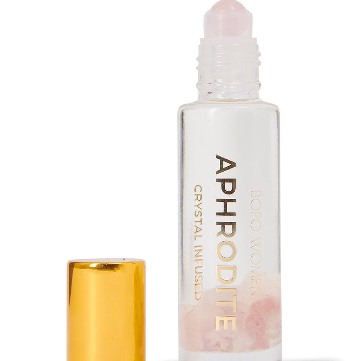 Roll-on bottle labeled 'Aphrodite' with a gold cap on a white background