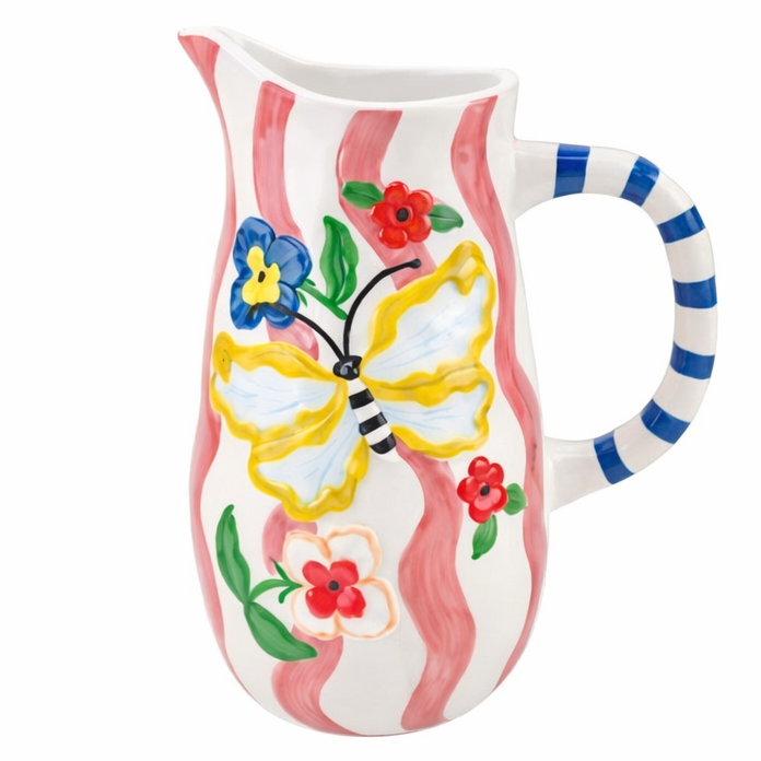Ceramic jug with butterfly design and striped handle on a white background