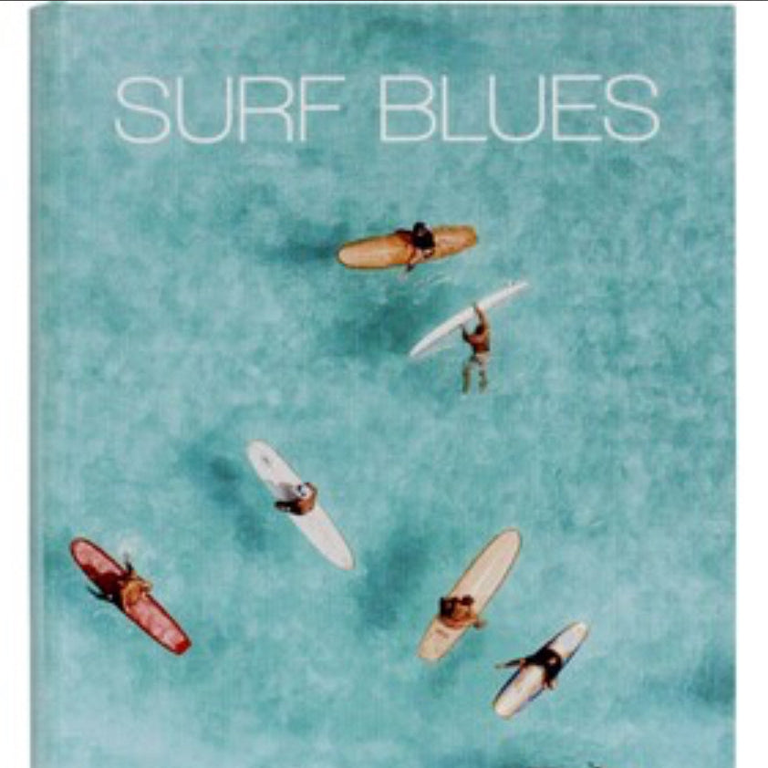 Book cover titled 'Surf Blues' with images of surfers and boards on a teal background