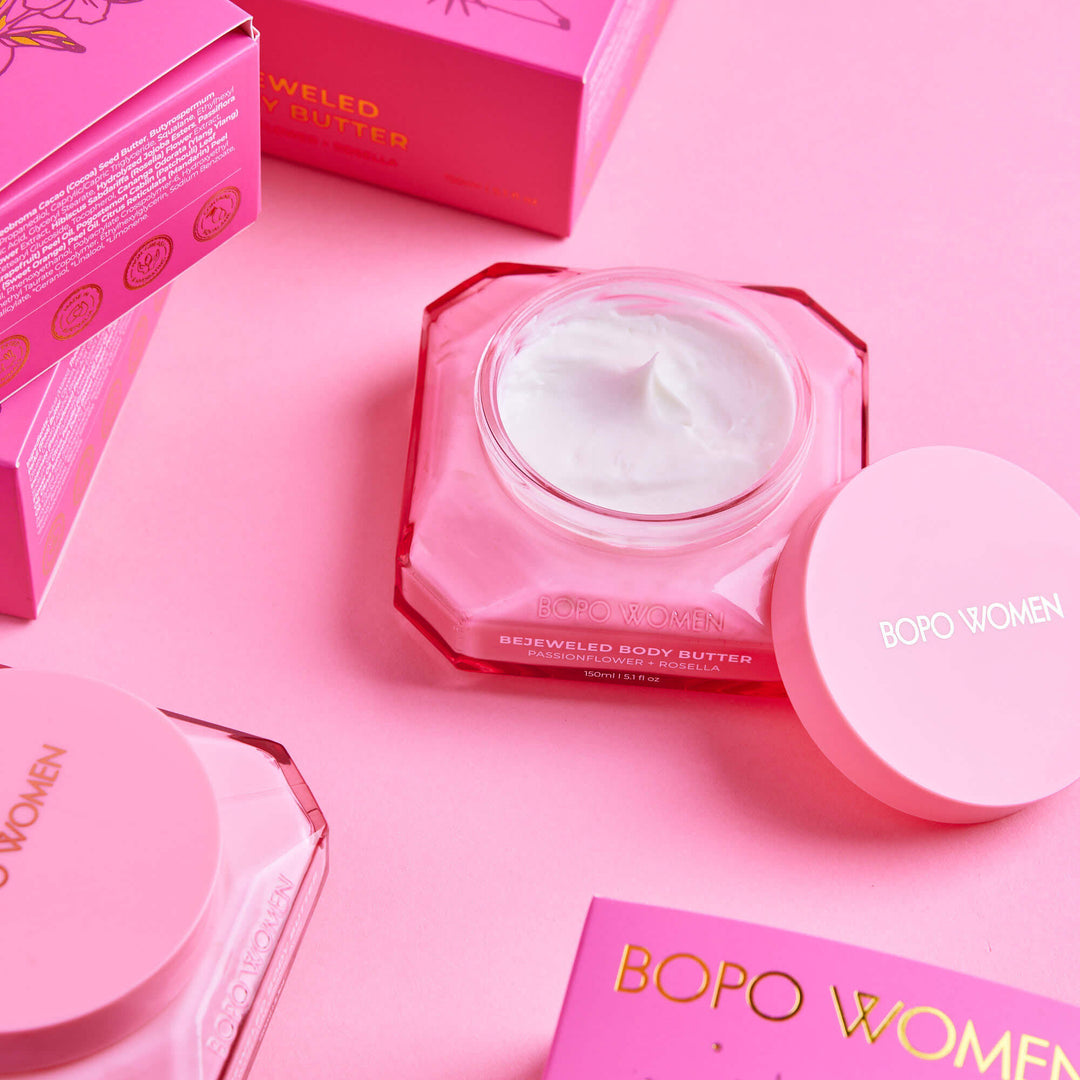 BOPO Women's body butter with packaging on a pink background