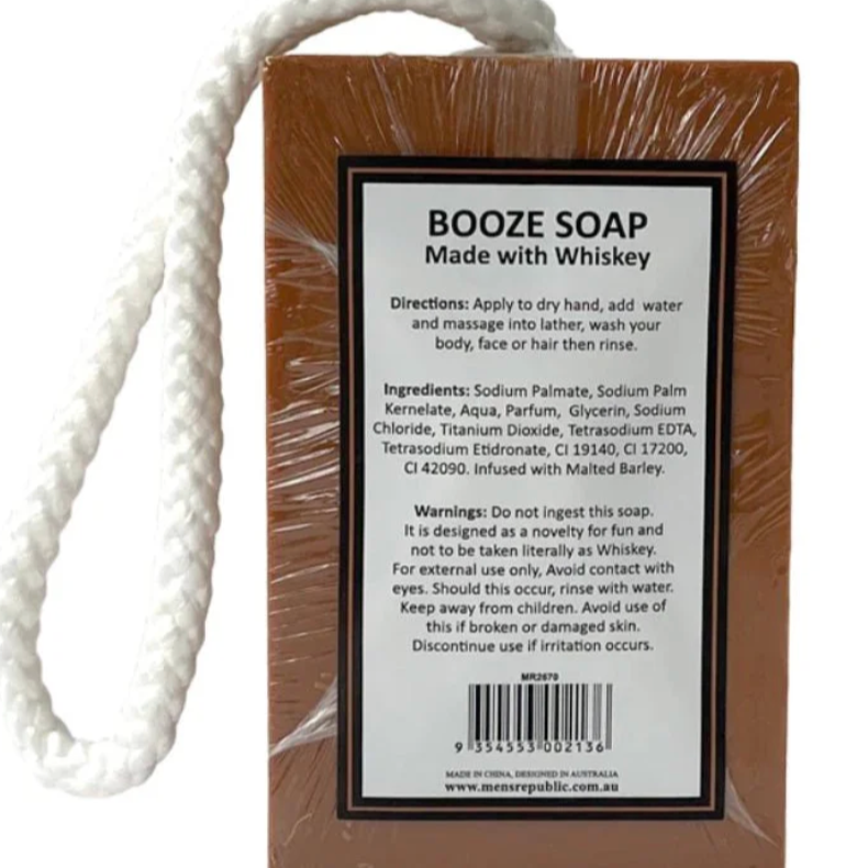Bar of soap with a rope and packaging displaying 'Booze Soap Made with Whiskey' on a white background.