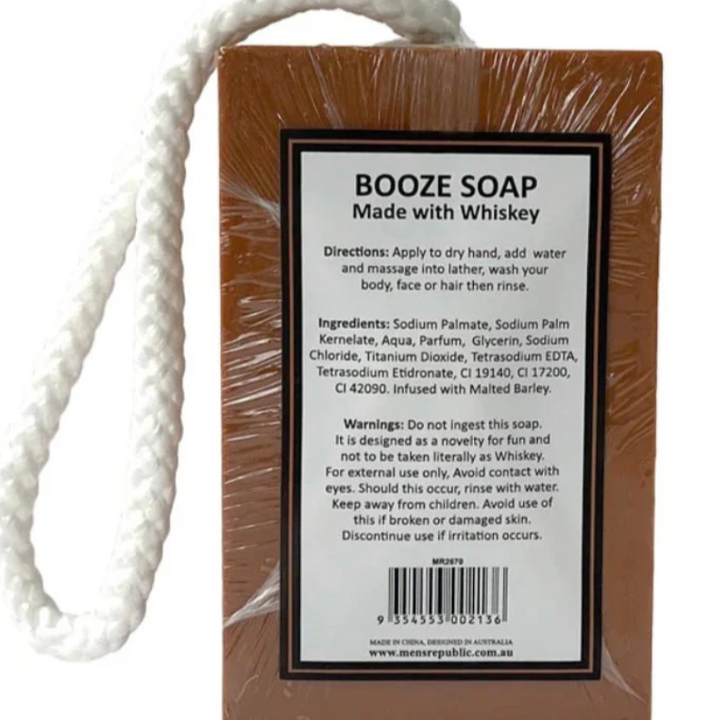 Bar of soap with a rope and packaging displaying 'Booze Soap Made with Whiskey' on a white background.