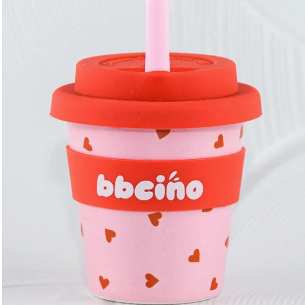 Pink cup with red lid and heart pattern, featuring the brand 'bbecca'.