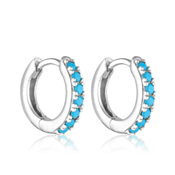 Silver hoop earrings with blue gemstones on a white background