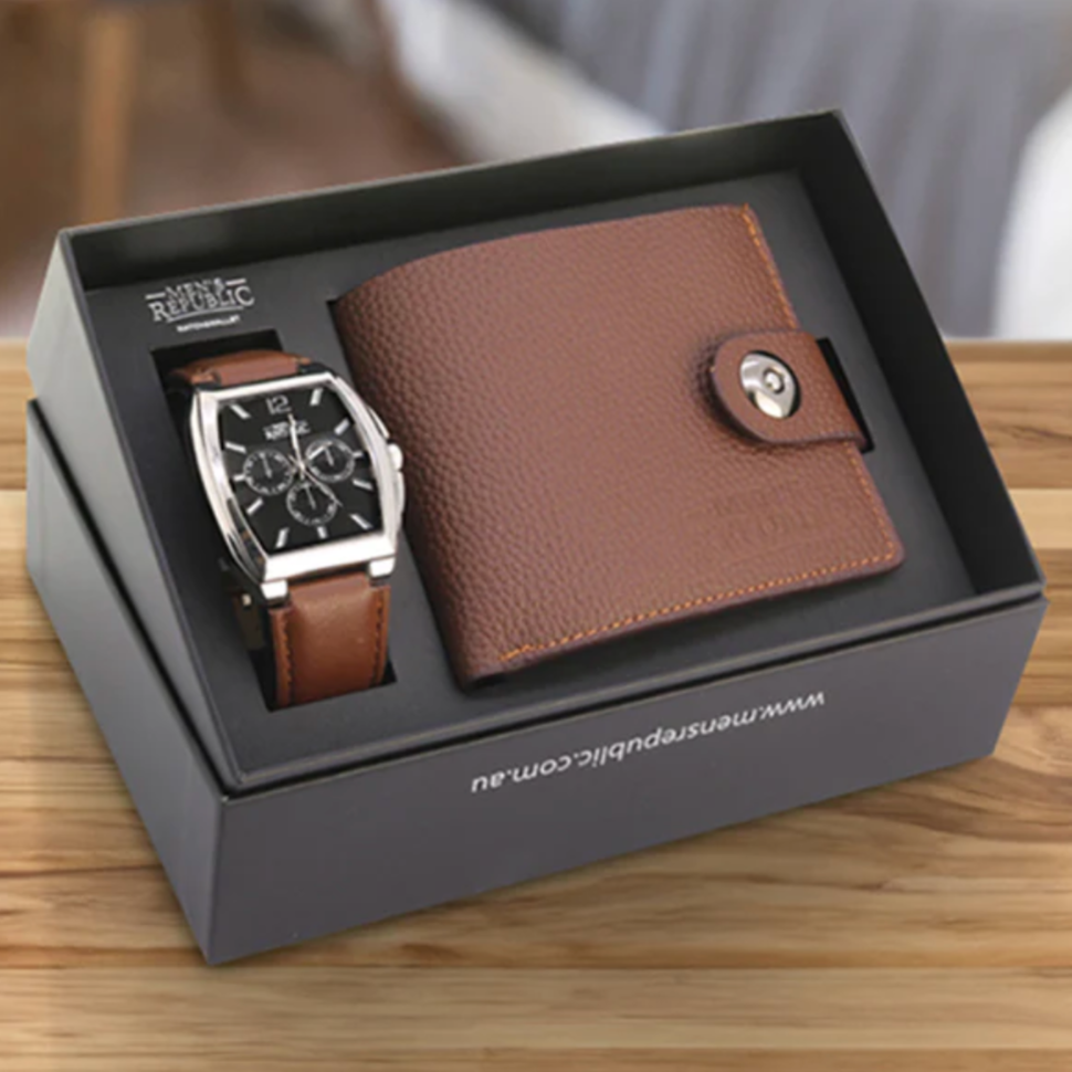 Watch and brown leather wallet set in a branded box on a wooden surface