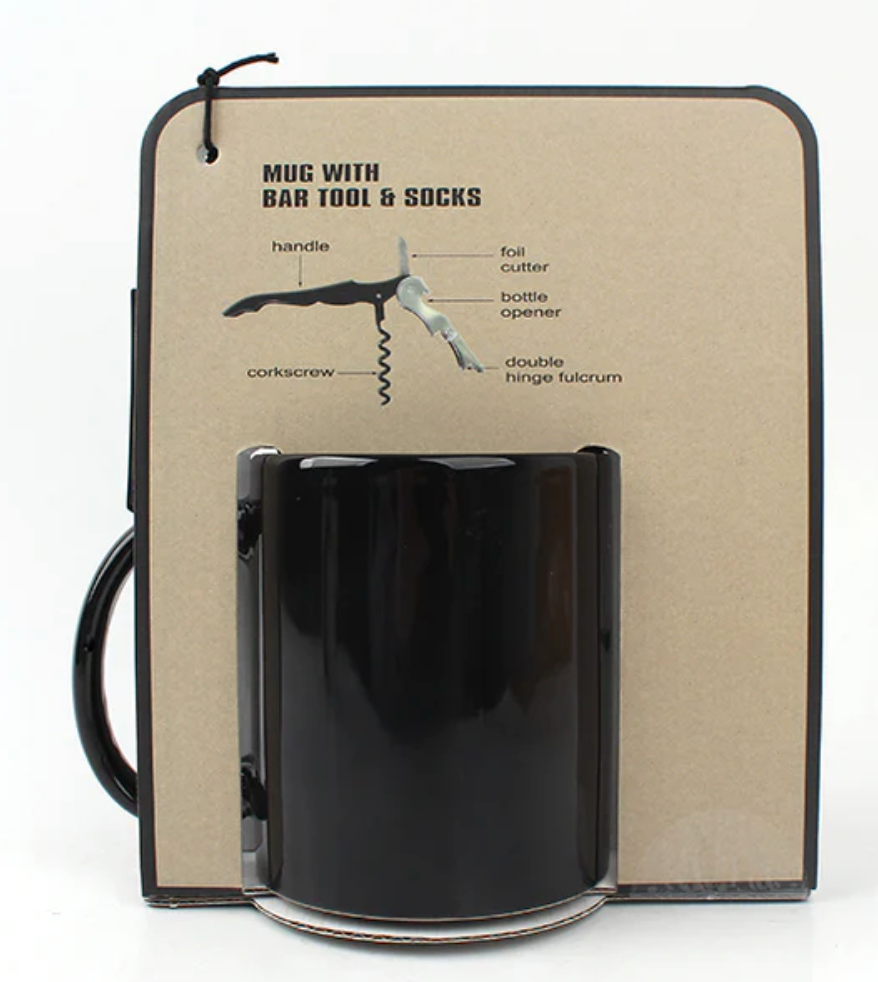 Black mug with bar tool and cork screw on a beige card with text