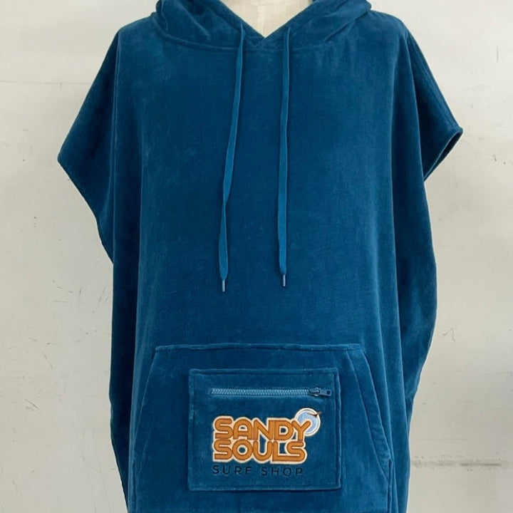 Blue hooded poncho towell with a pocket featuring 'Sandy Souls' branding on a white background